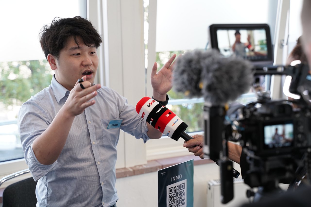 A media interview on the floor